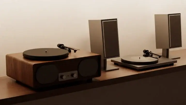 Record player paired with a set of matching stereo speakers on a wooden console